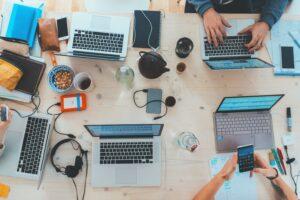 Collaborative workspace including latops, phones, notepads and pens