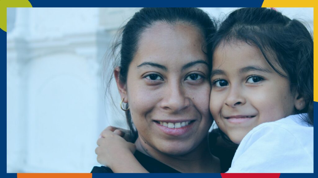 A smiling student and child