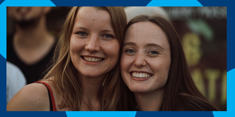 Two smiling women