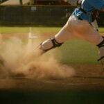 Baseball player skidding into Home Base