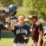 Baseball players grinning at camera