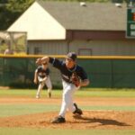 Picture of baseball player who has just thrown a pitch
