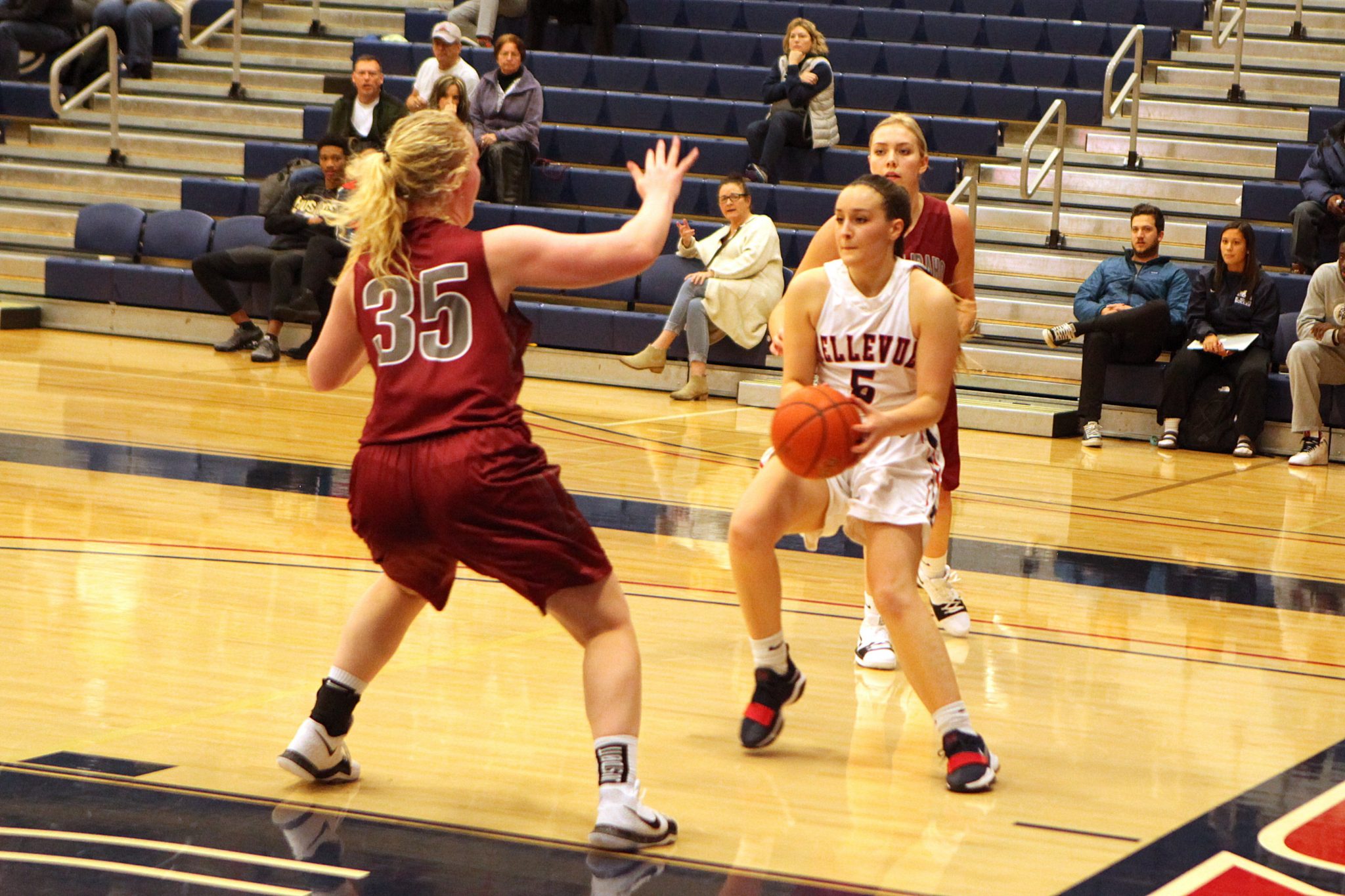 A BC player with the ball faces a defender