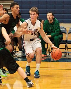 Bellevue College men's basketball player Brian Zehr brings the ball up against Linn-Benton.