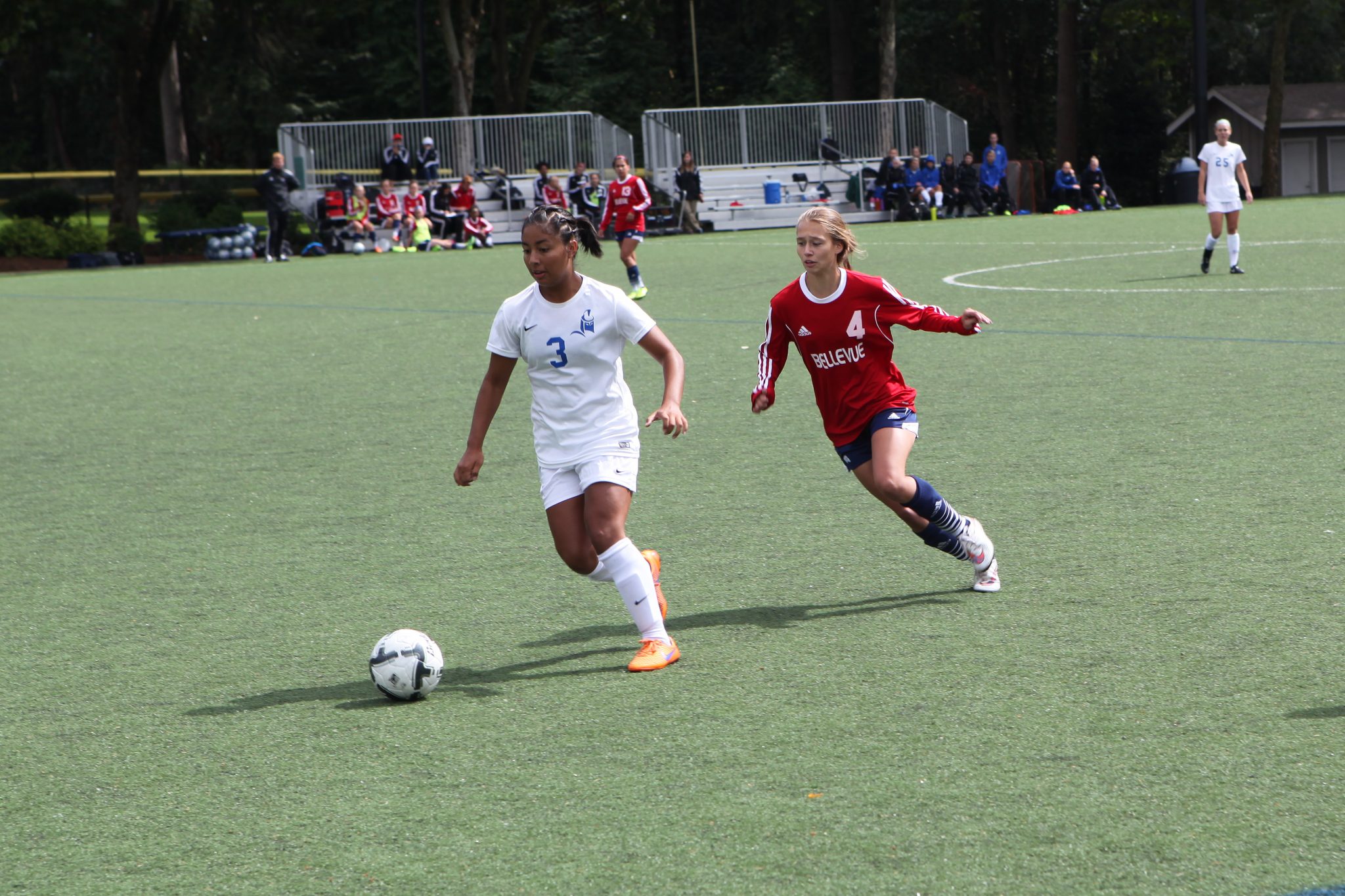 Image of BC's Chelsea Delgado pursuing a Lane player in a women's soccer match
