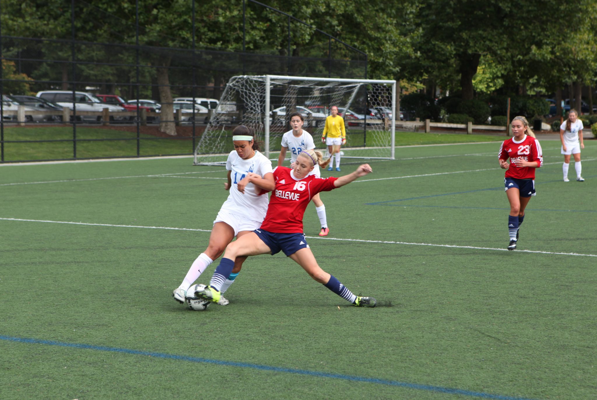 Image of Bellevue's Emma Foust battling for the ball against Lane in a women's soccer match on Friday, September 4, 2015