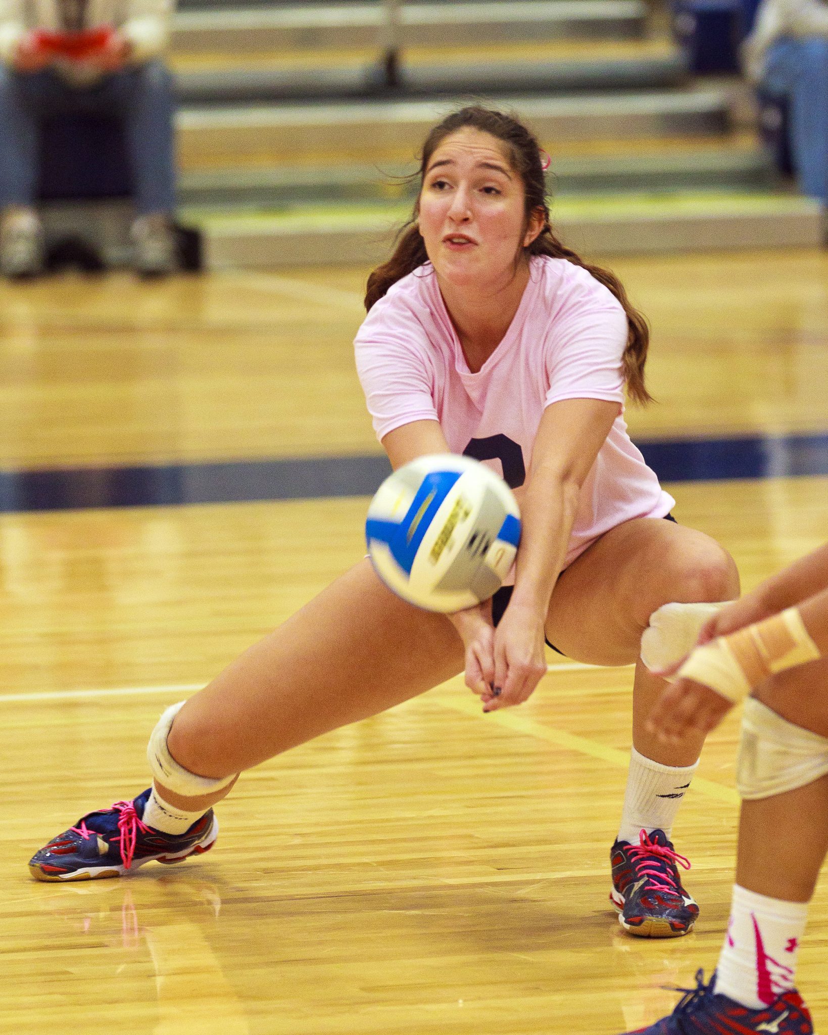 A Bellevue College volleyball player returns a shot