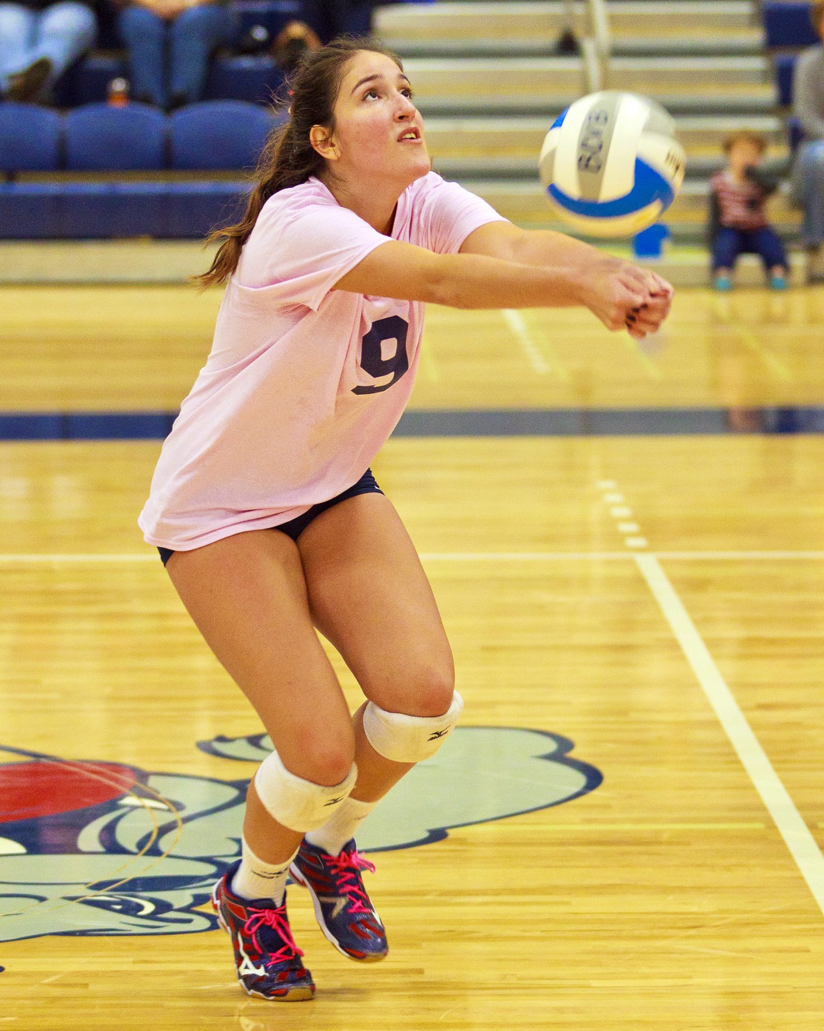 A Bellevue College volleyball player returns a shot