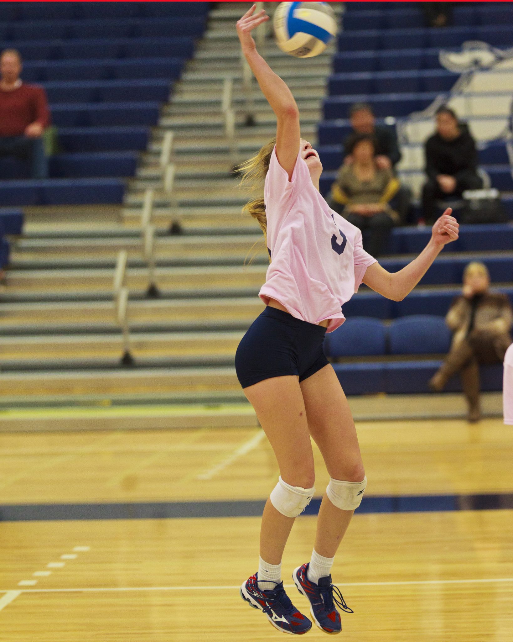 A Bellevue College volleyball player hits a shot
