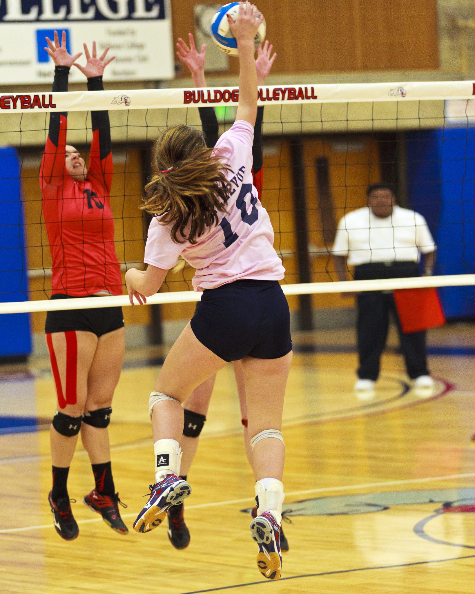 A Bellevue College volleyball player hits a shot