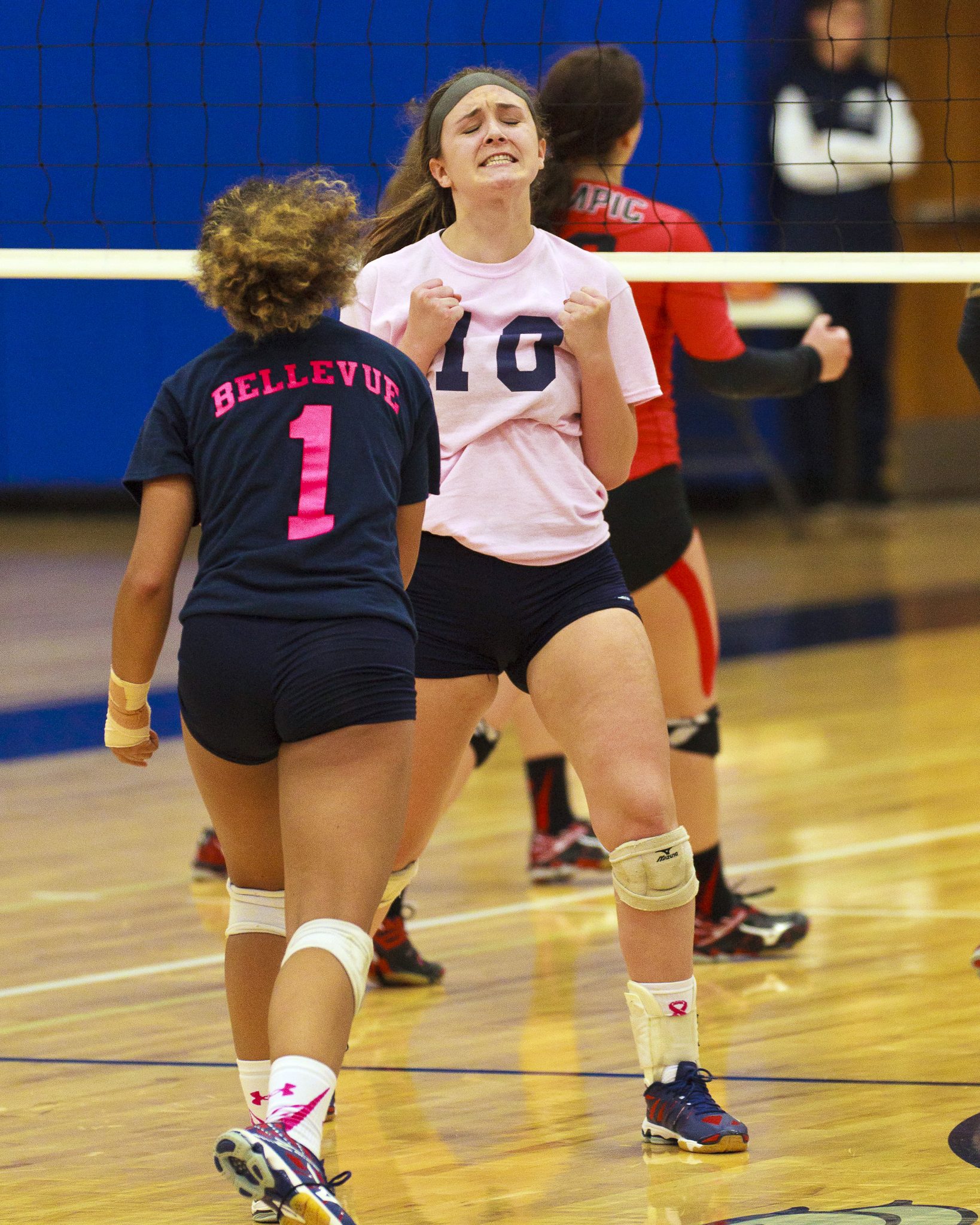 A Bellevue College volleyball player celebrates a good play