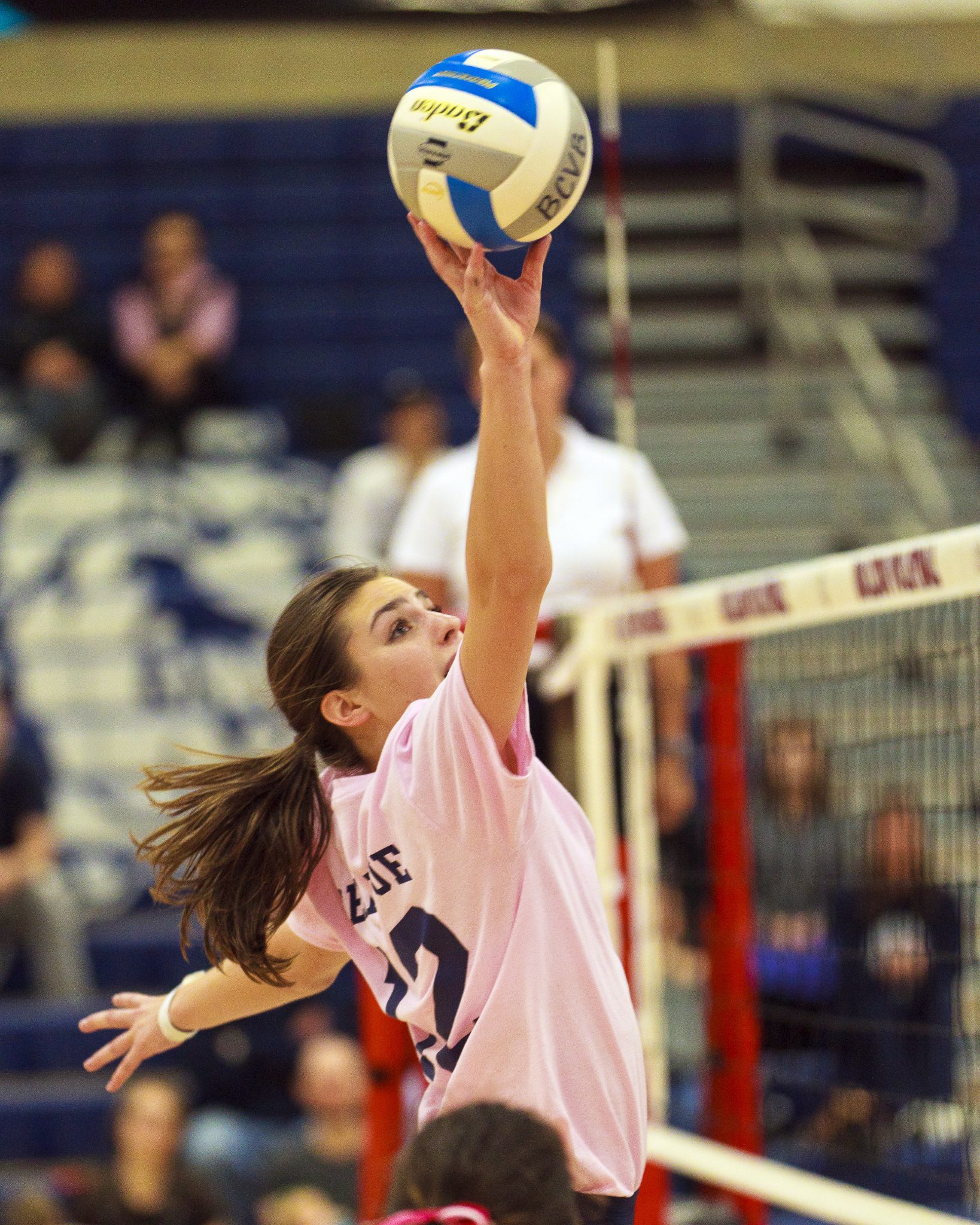 A Bellevue College volleyball player hits a shot