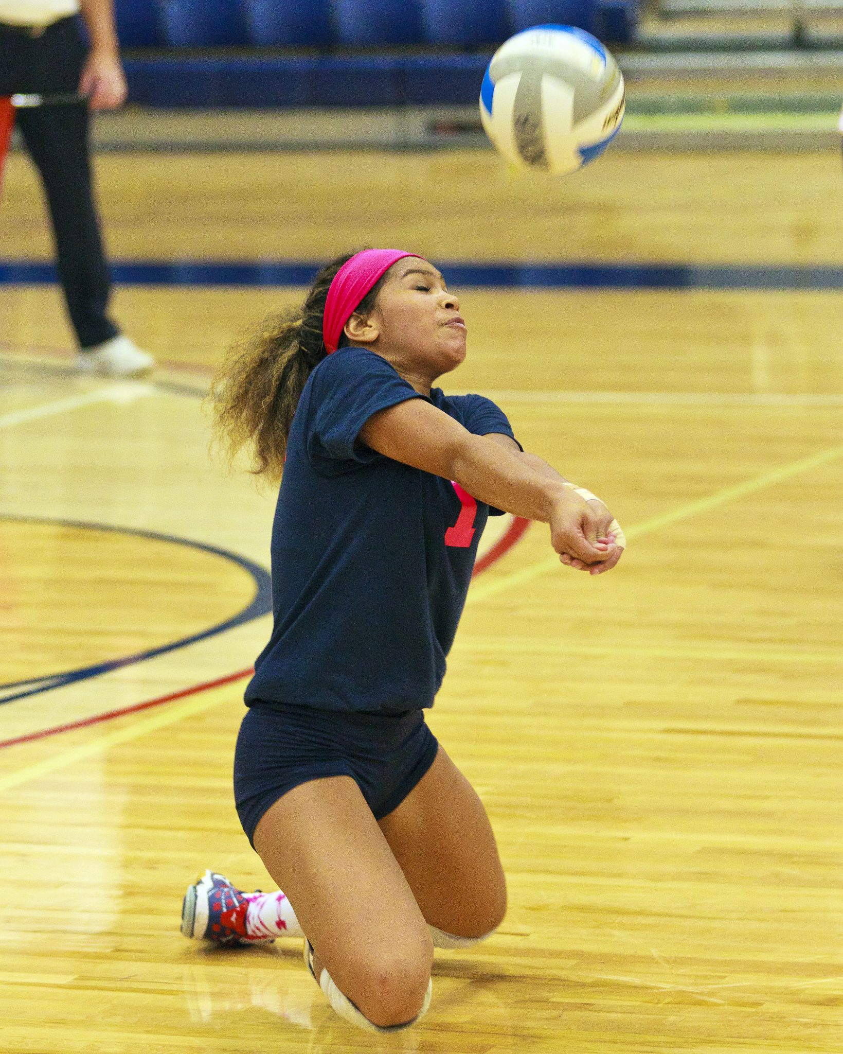 A Bellevue College volleyball player returns a shot