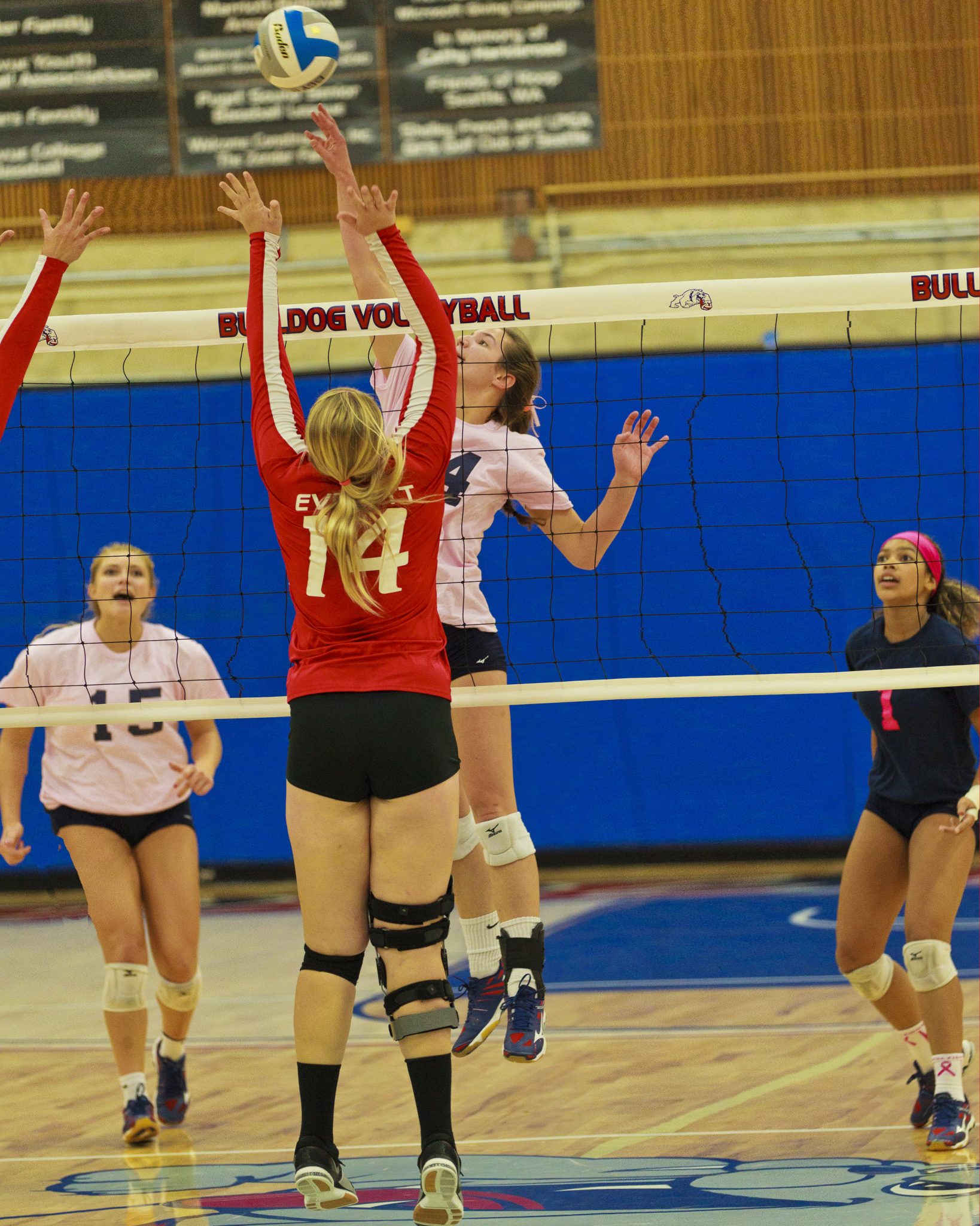 A Bellevue College volleyball player hits a shot