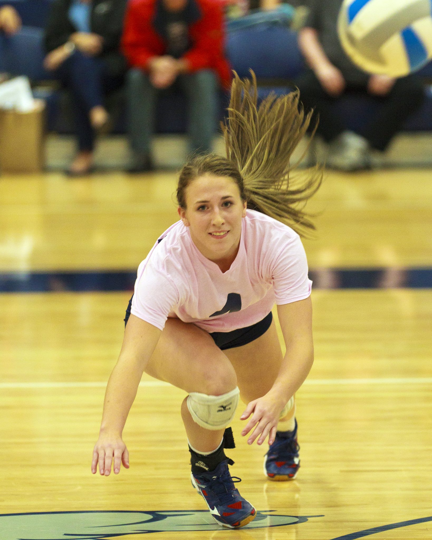 A Bellevue College volleyball player returns a shot