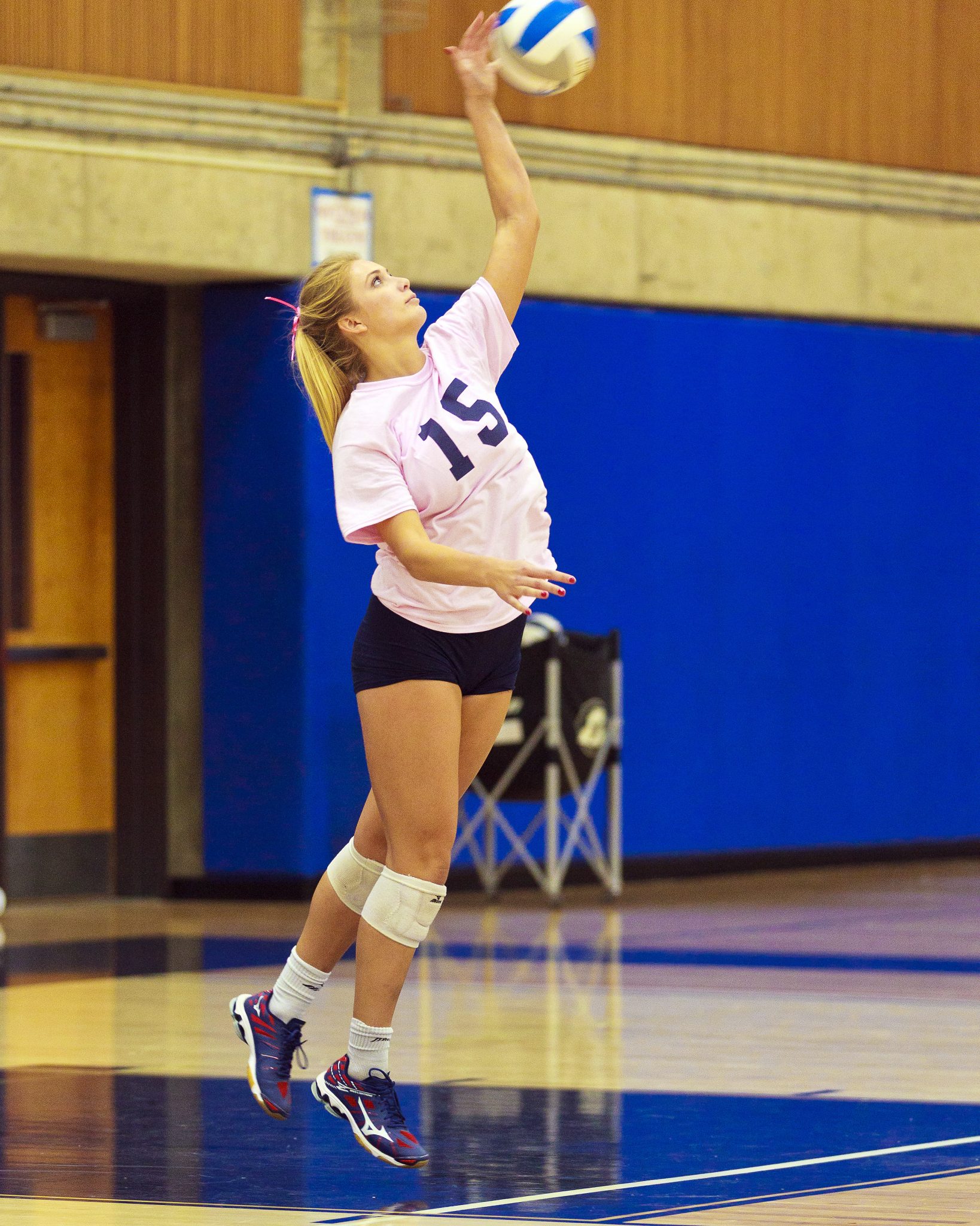 A Bellevue College volleyball player hits a shot