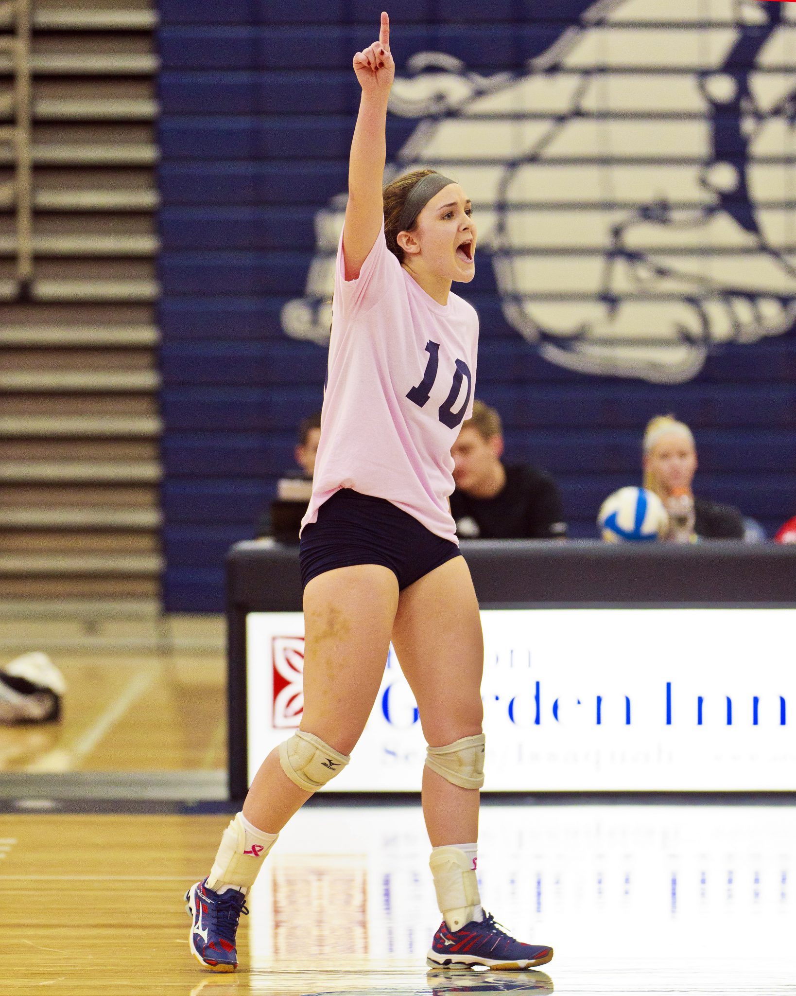 A Bellevue College volleyball player celebrates a good play