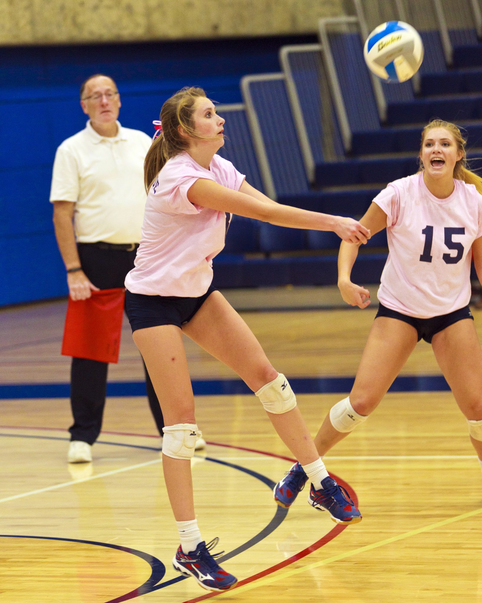 A Bellevue College volleyball player returns a shot