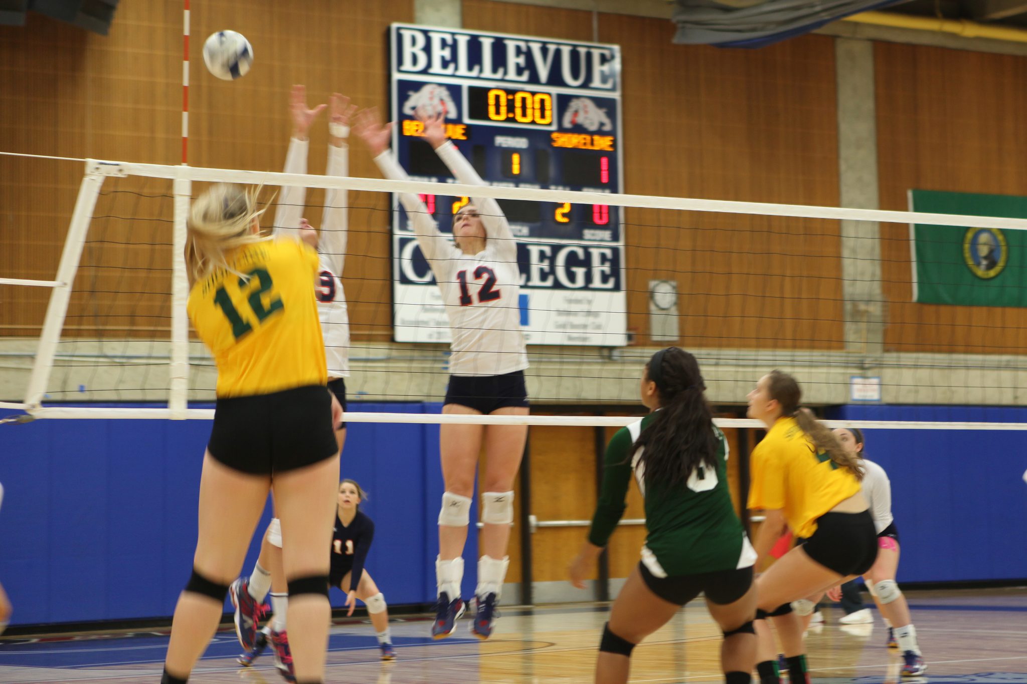 Two Bellevue players go for a block against Shoreline