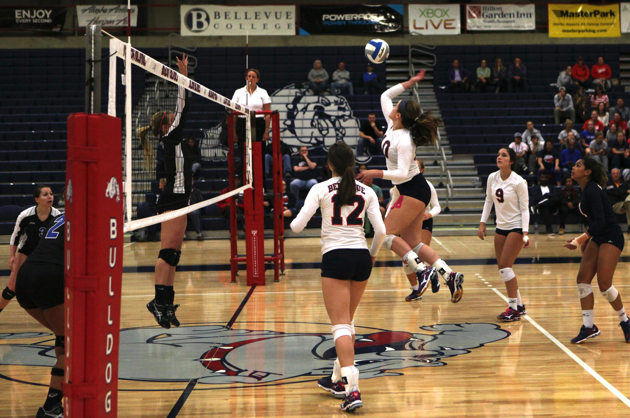 A Bellevue College player hits a shot against Edmonds