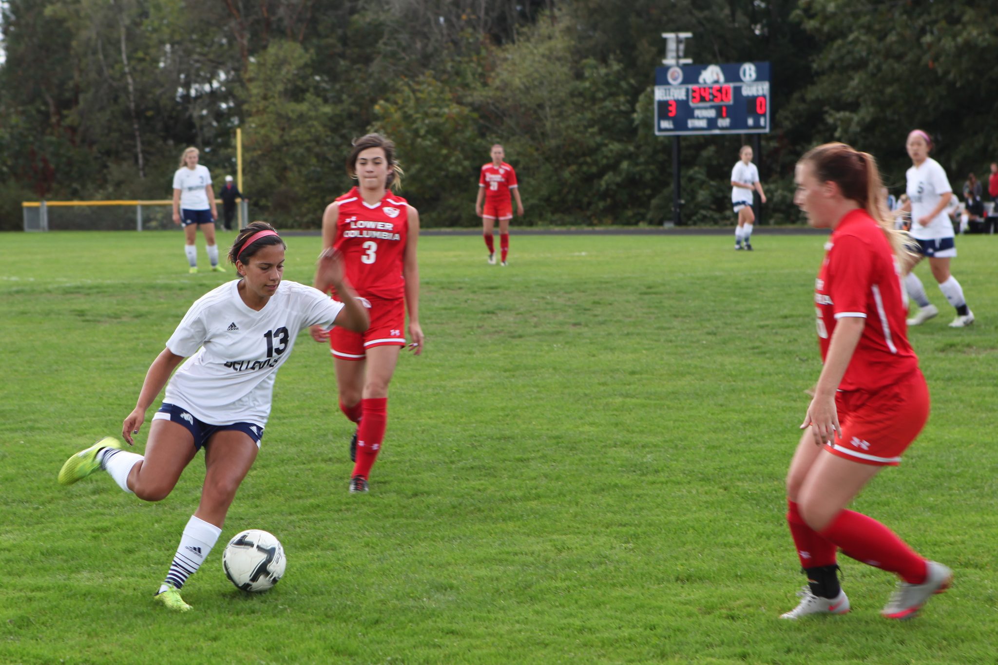 A BC player advances the ball against Lower Columbia in a women's soccer match