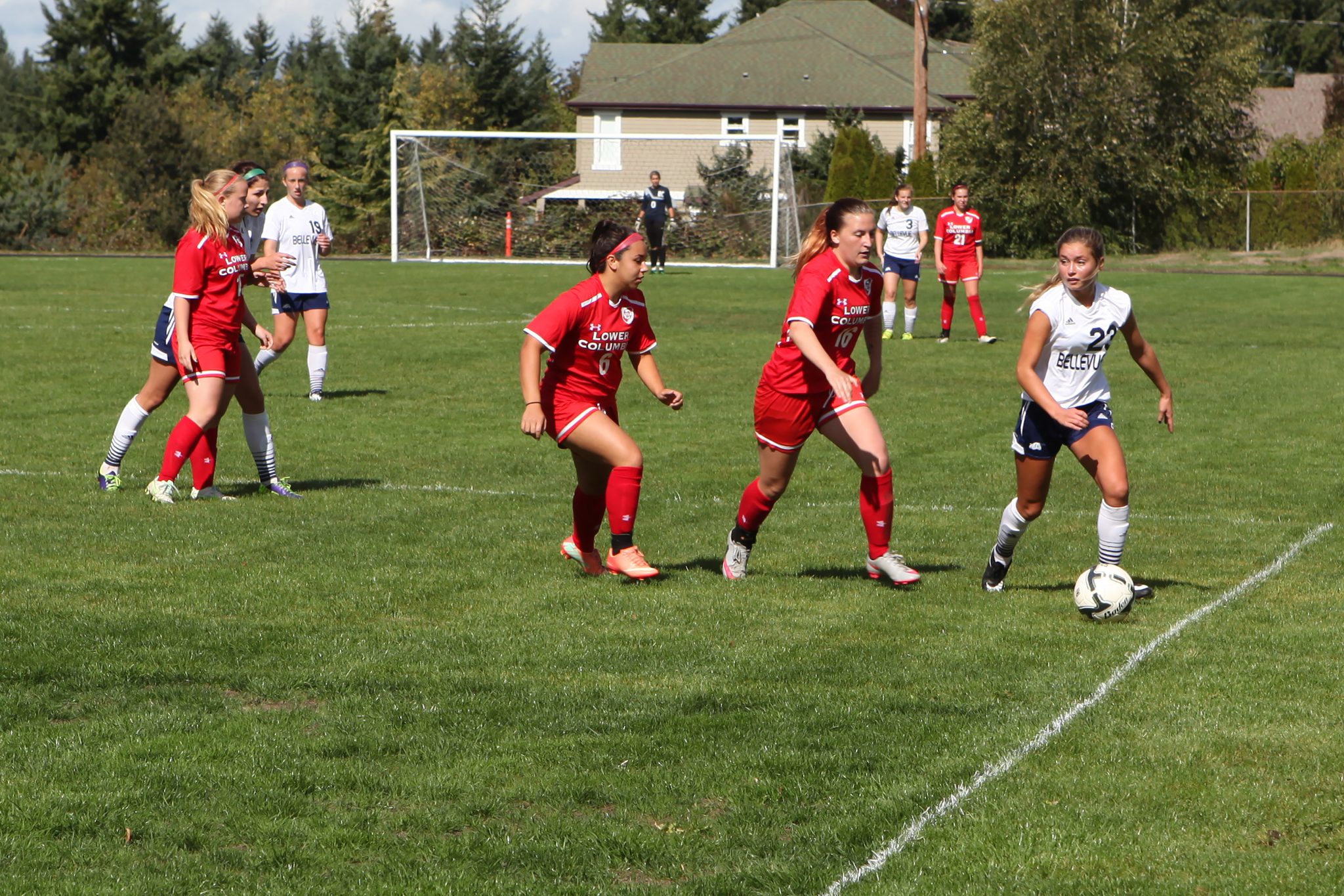 A BC player advances the ball against Lower Columbia in a women's soccer match
