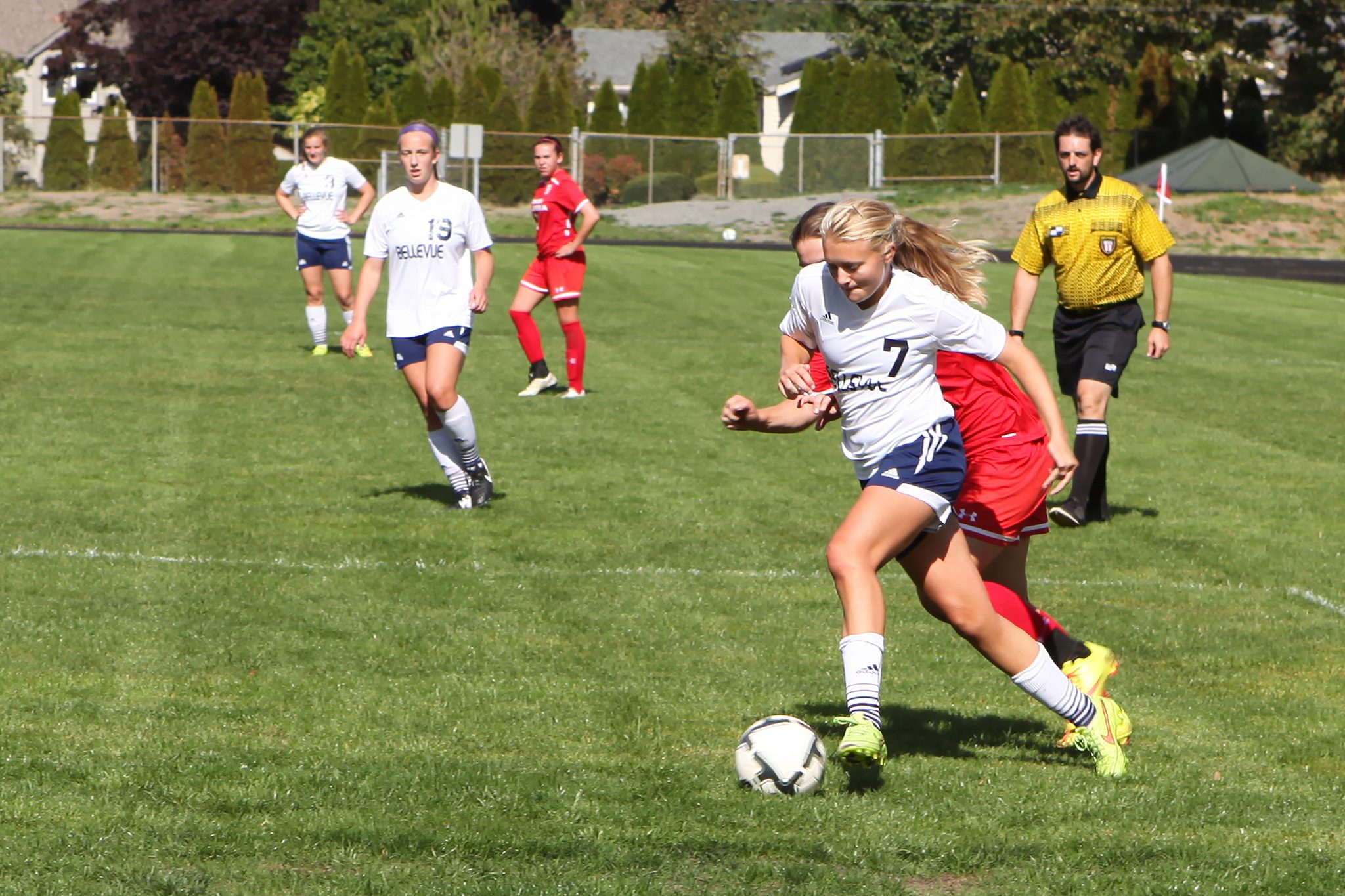 A BC player advances the ball against Lower Columbia in a women's soccer match