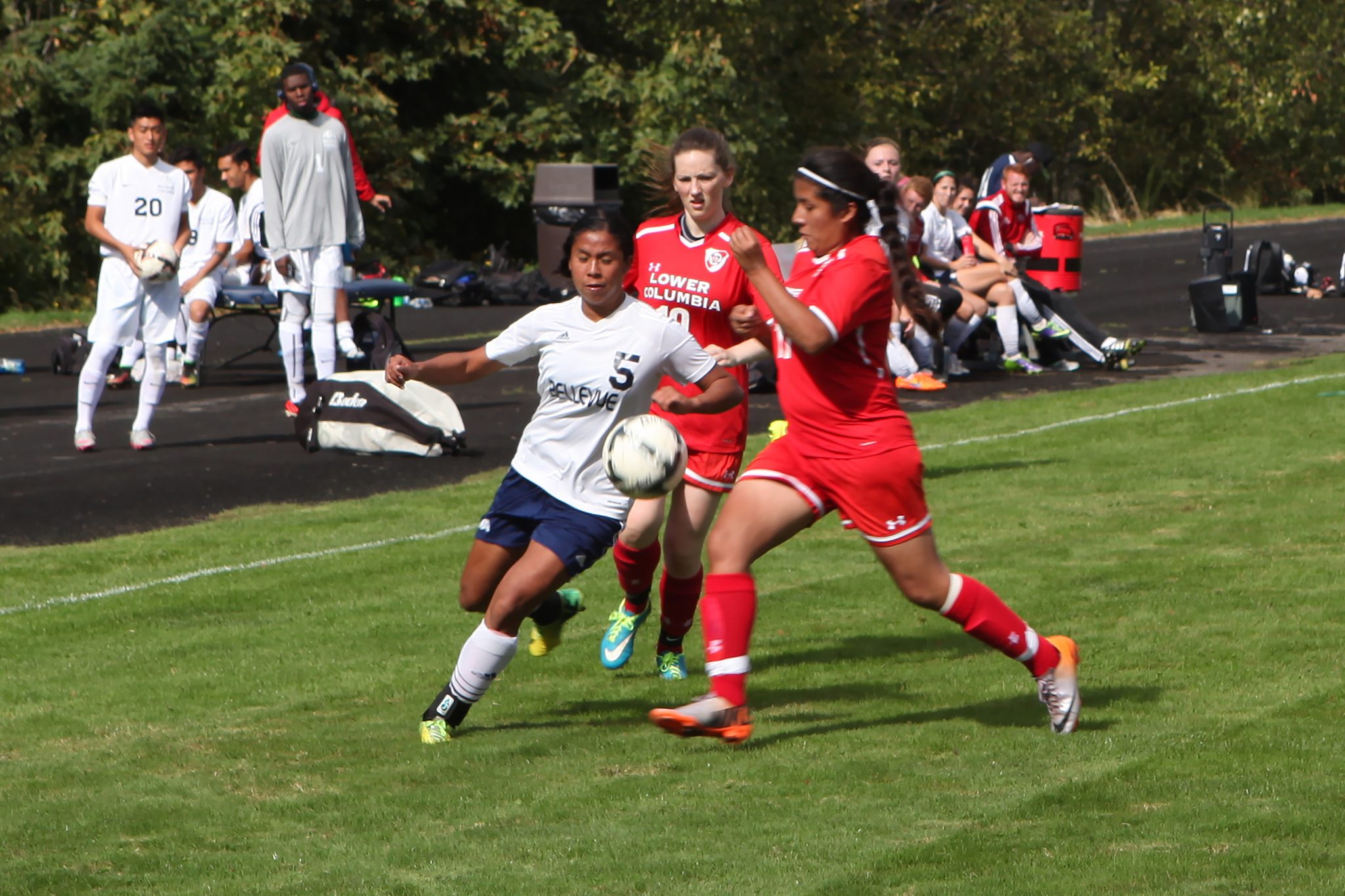 A BC player advances the ball against Lower Columbia in a women's soccer match