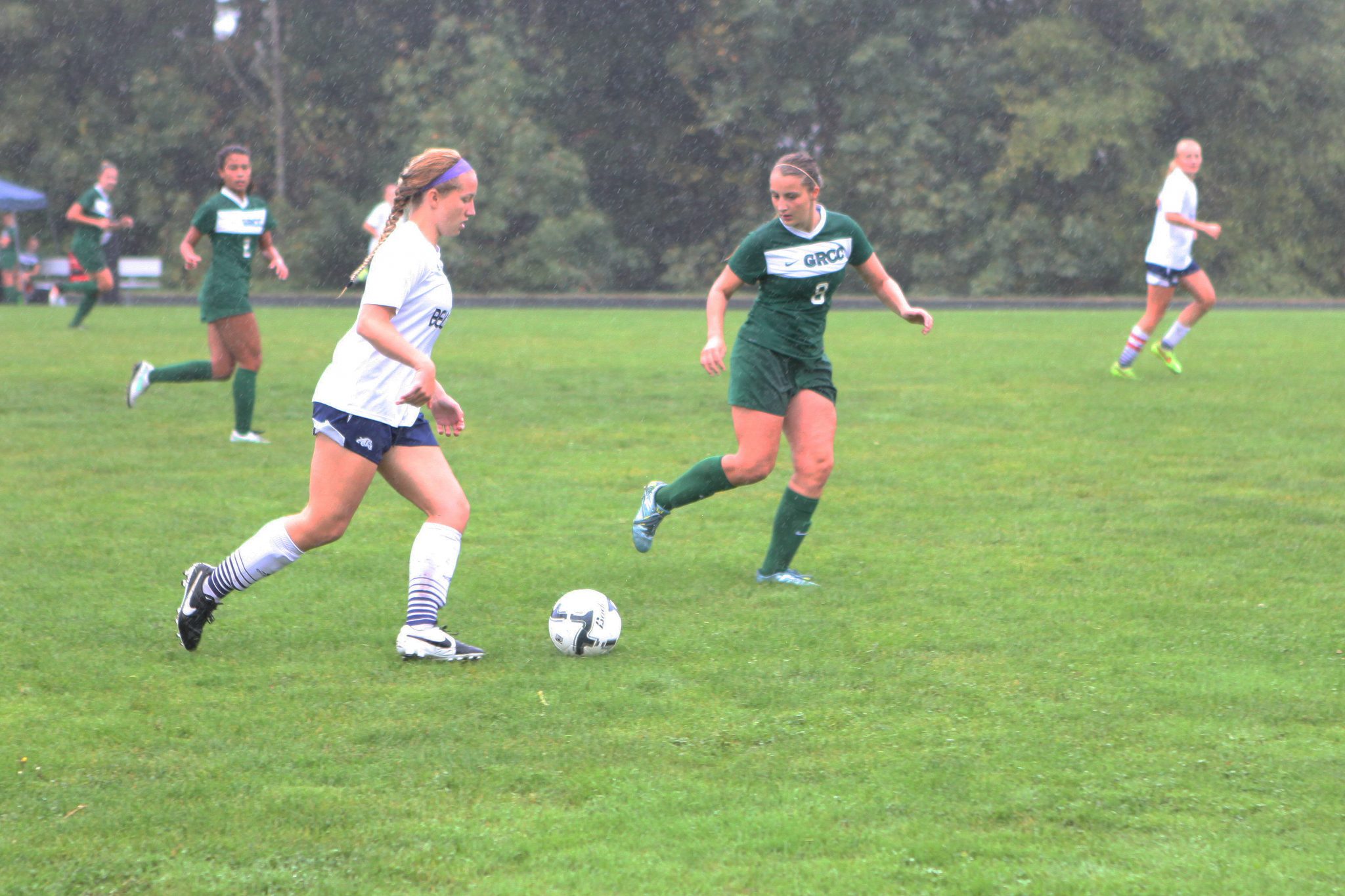 A Belleve Colllege player advances the ball against Green River in a women's soccer match