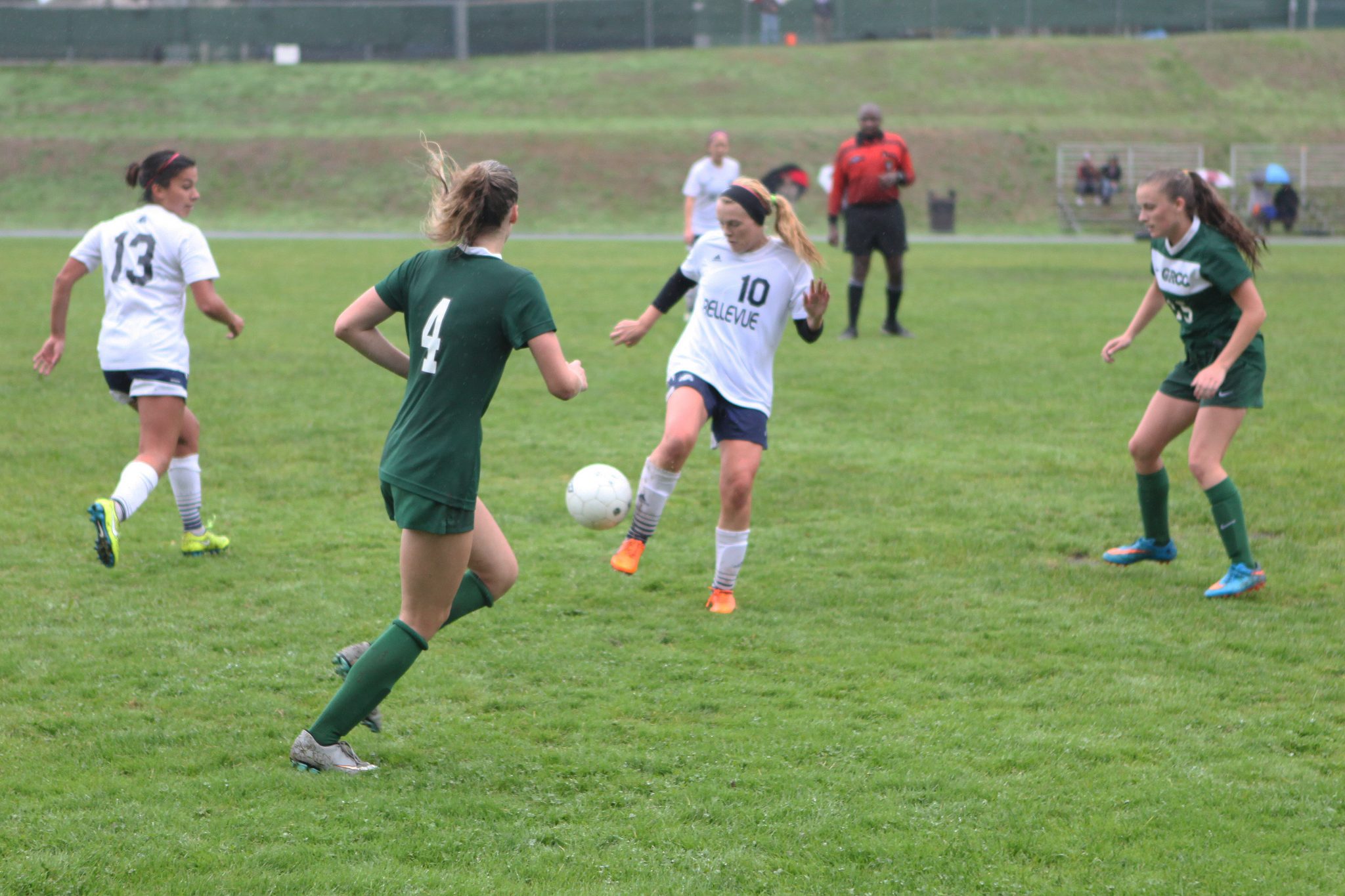 A Belleve Colllege player advances the ball against Green River in a women's soccer match