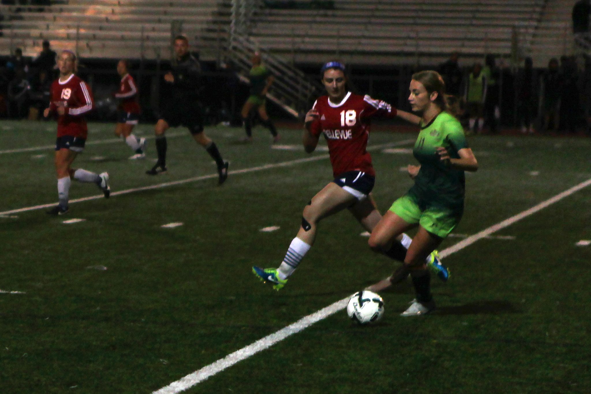 A Belleve Colllege player defends against Highline in a women's soccer match