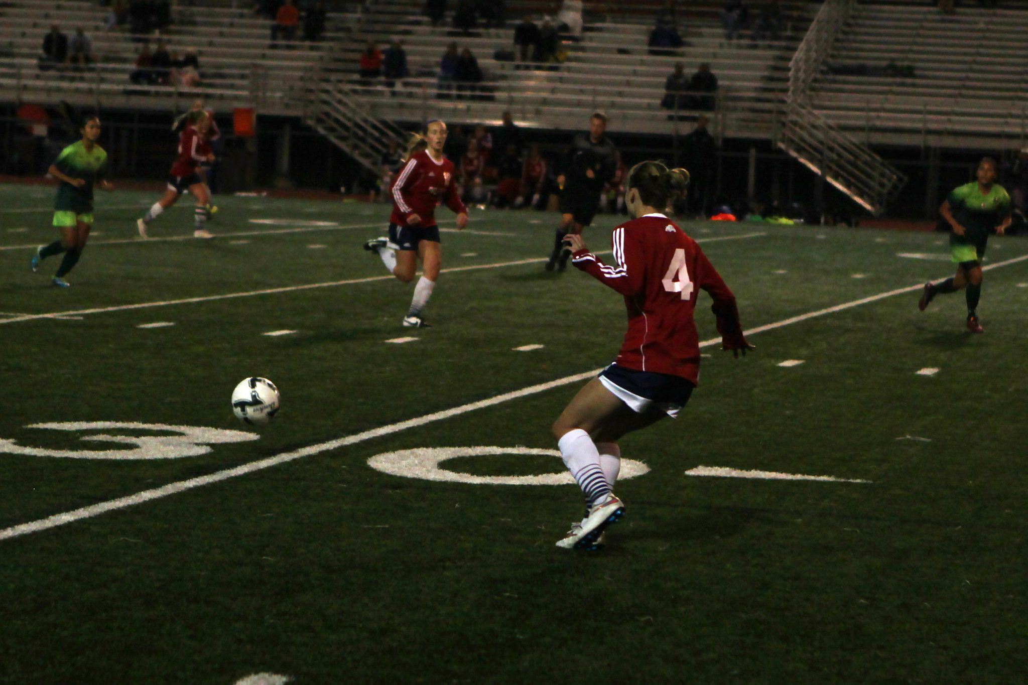 A Belleve Colllege player advances to the ball against Highline in a women's soccer match