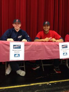 Cascade HS recruits Michael Carter and Brennen Hancock at their school signing ceremony. 