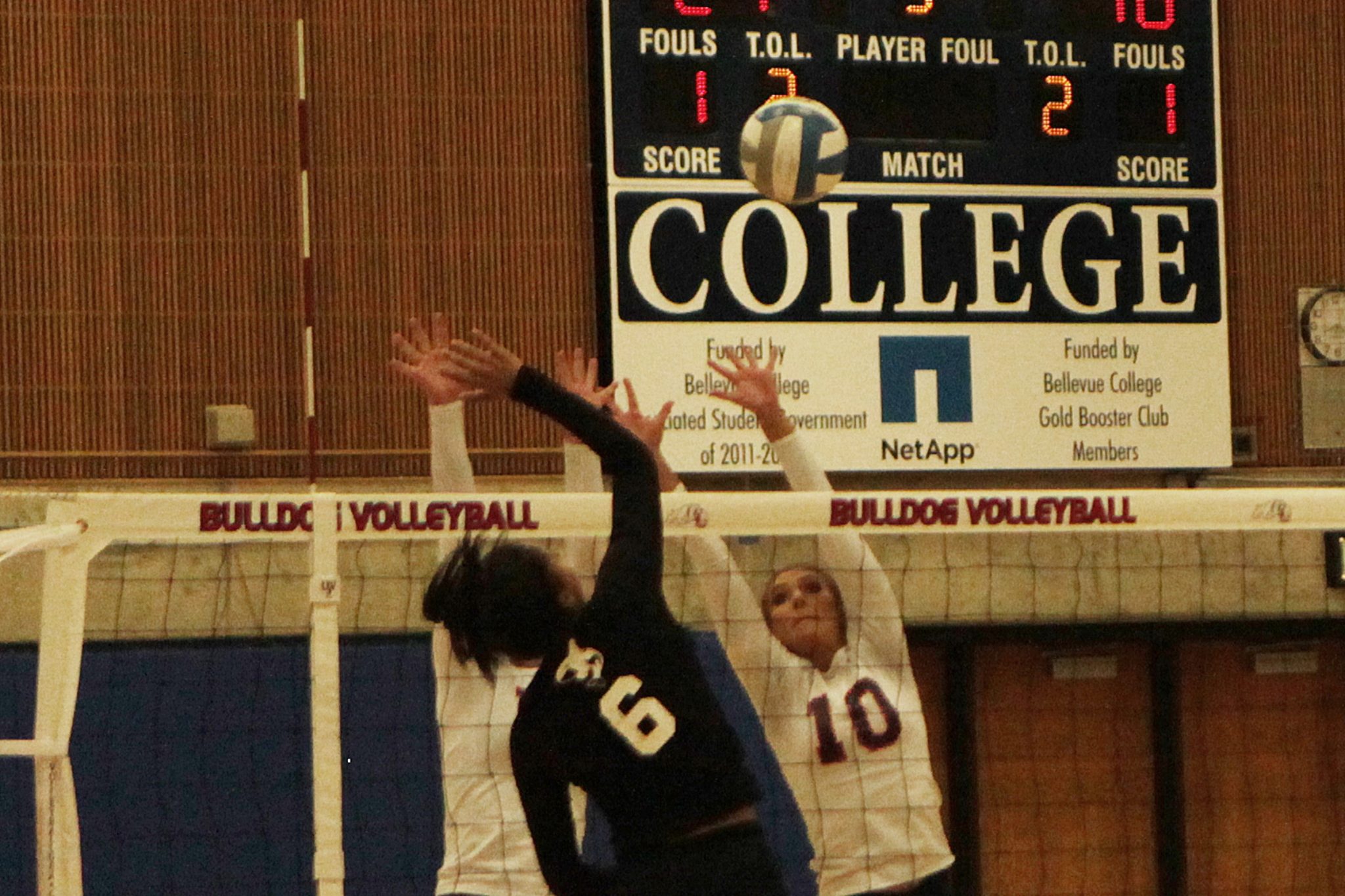 A BC volleyball player goes up for the block against Whatcom
