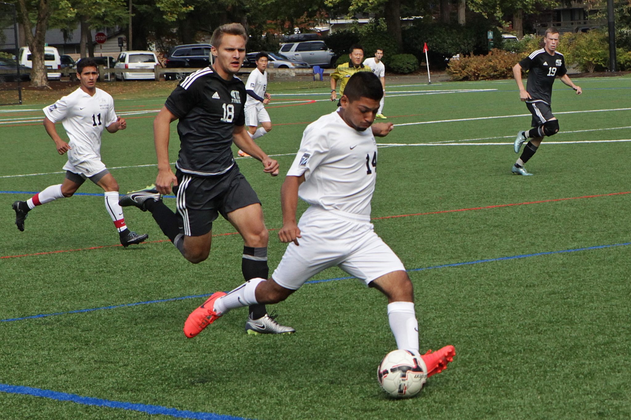 A BC men's soccer player kicks the ball vs. Tacoma