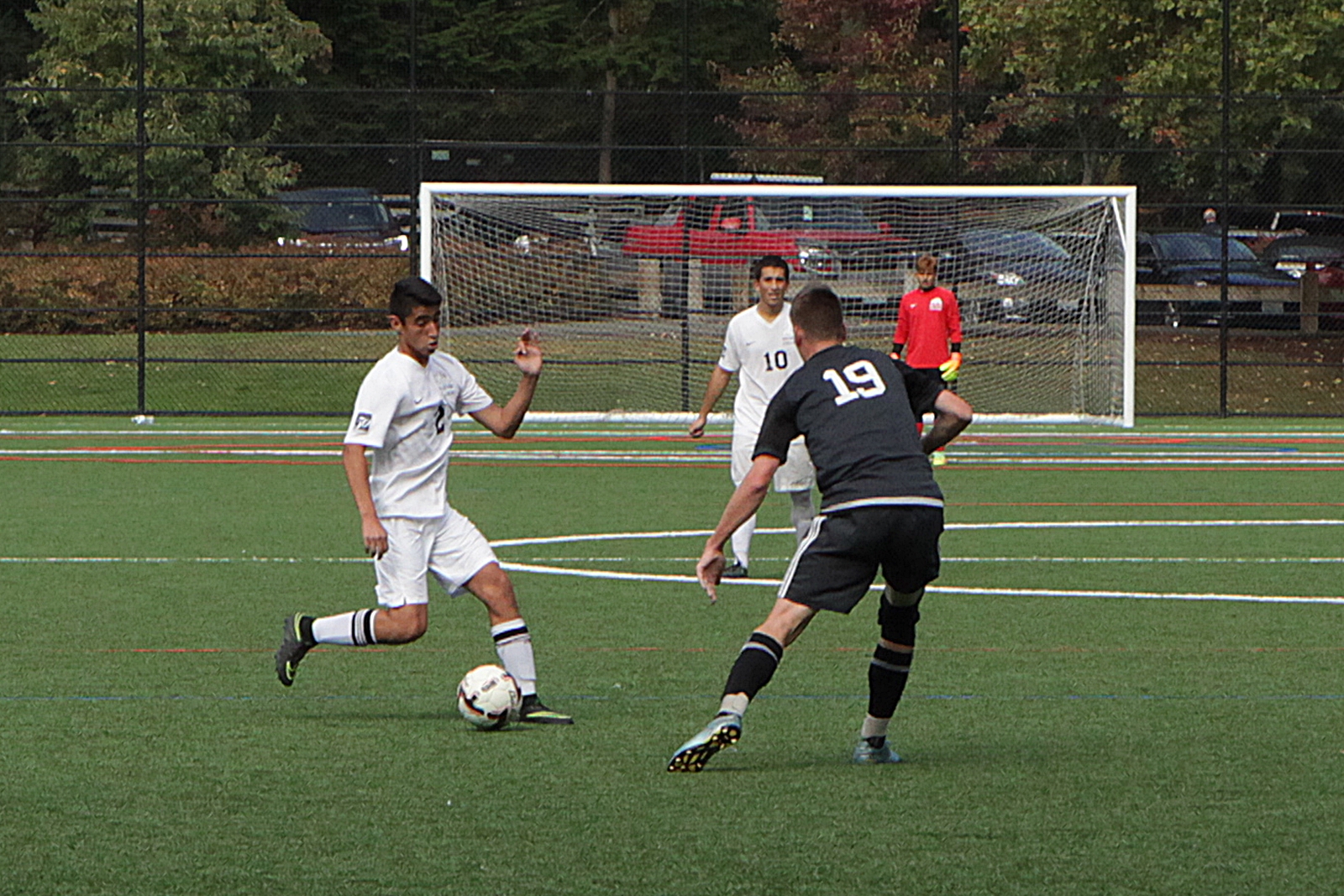 A BC men's soccer player kicks the ball vs. Tacoma