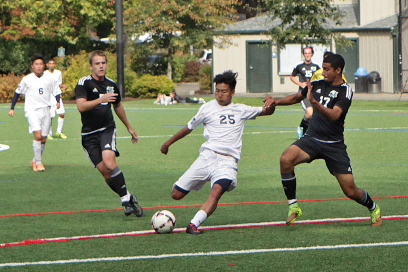 A BC men's soccer player kicks the ball vs. Tacoma