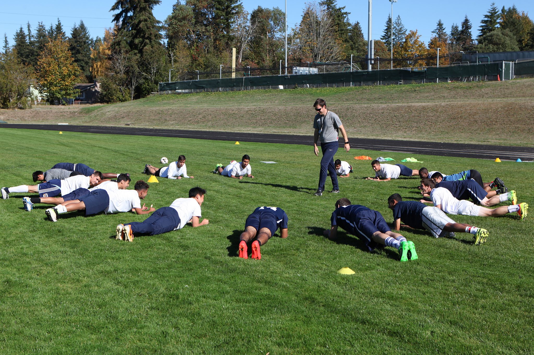 BC men's soccer coach David O'Neill puts his team through conditioning drills