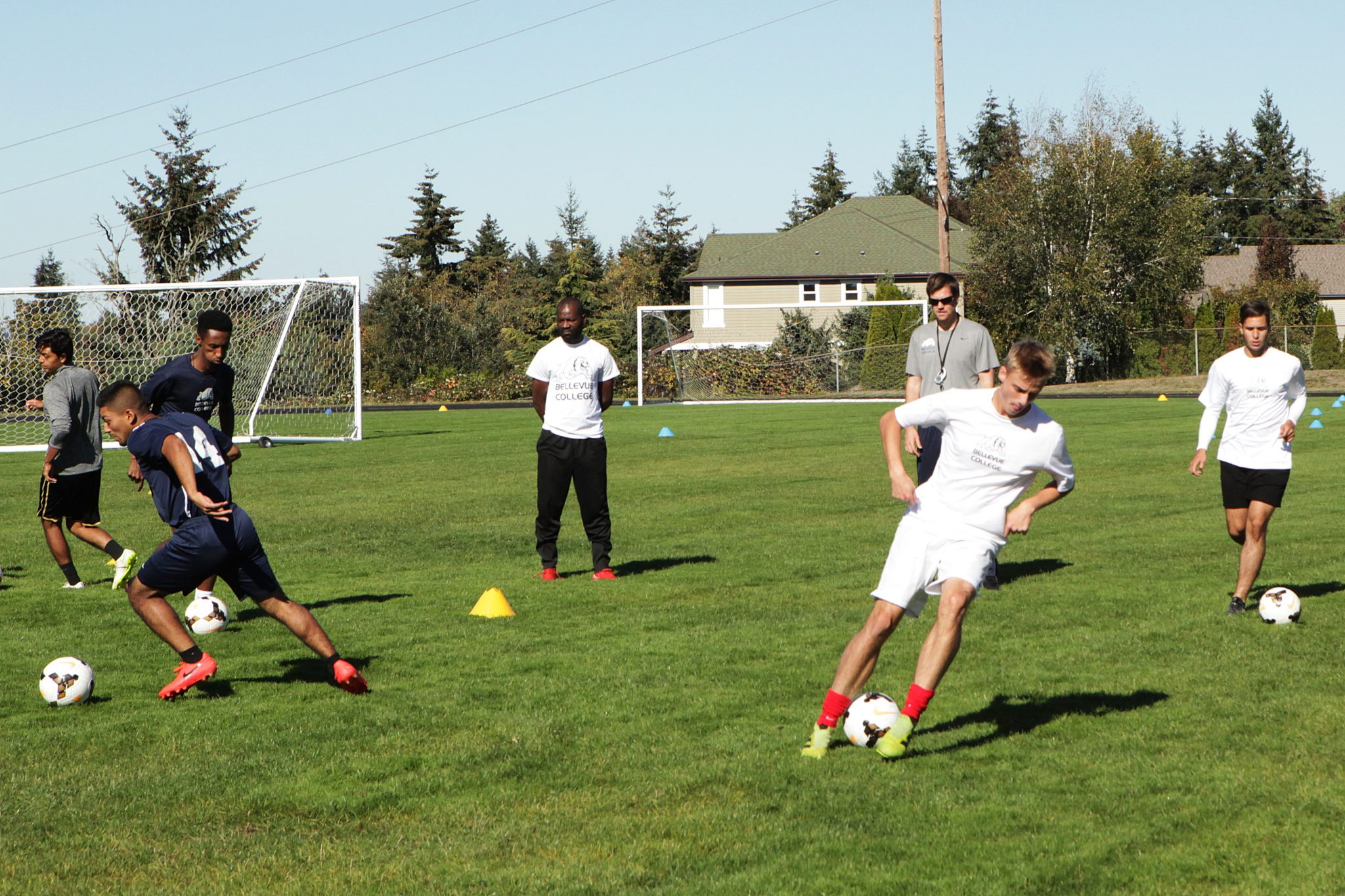 BC men's soccer players take part in ball control and passing drills at practice