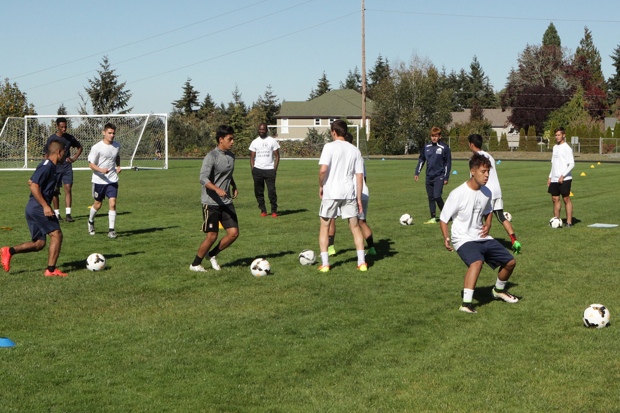 BC men's soccer players take part in ball control and passing drills at practice