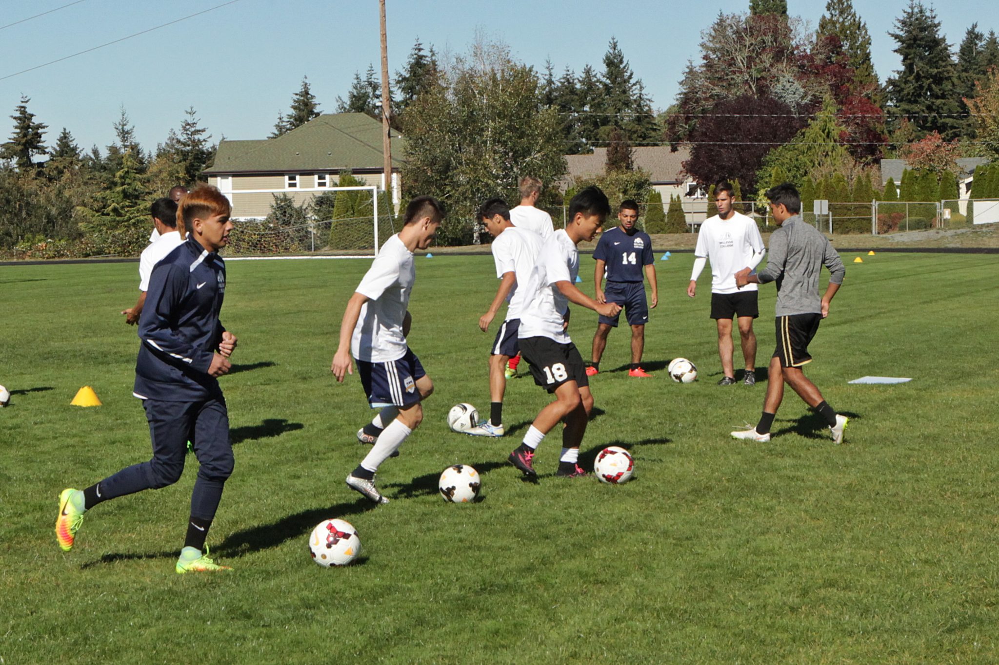 BC men's soccer players take part in ball control and passing drills at practice