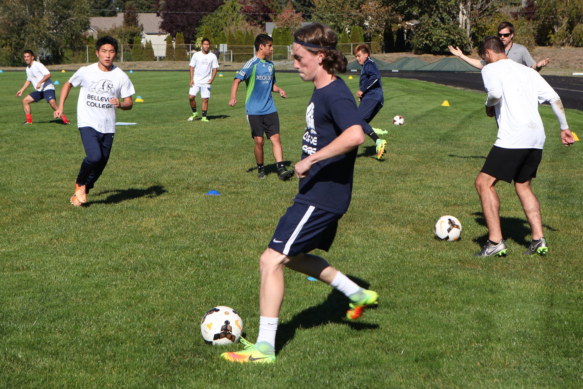 BC men's soccer players take part in ball control and passing drills at practice