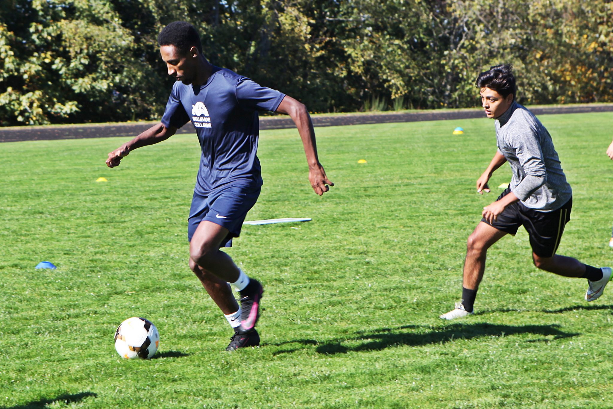 BC men's soccer players take part in ball control and passing drills at practice