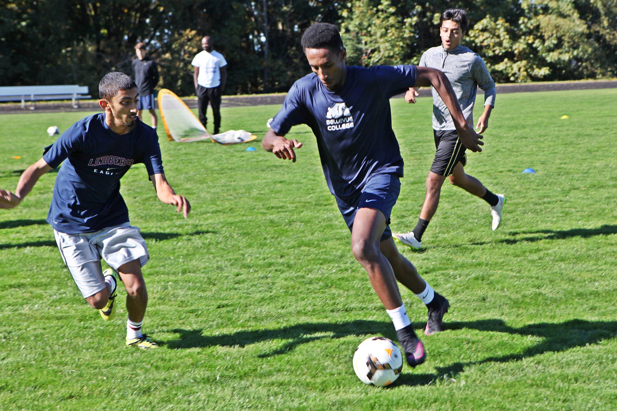 BC men's soccer players take part in ball control and passing drills at practice