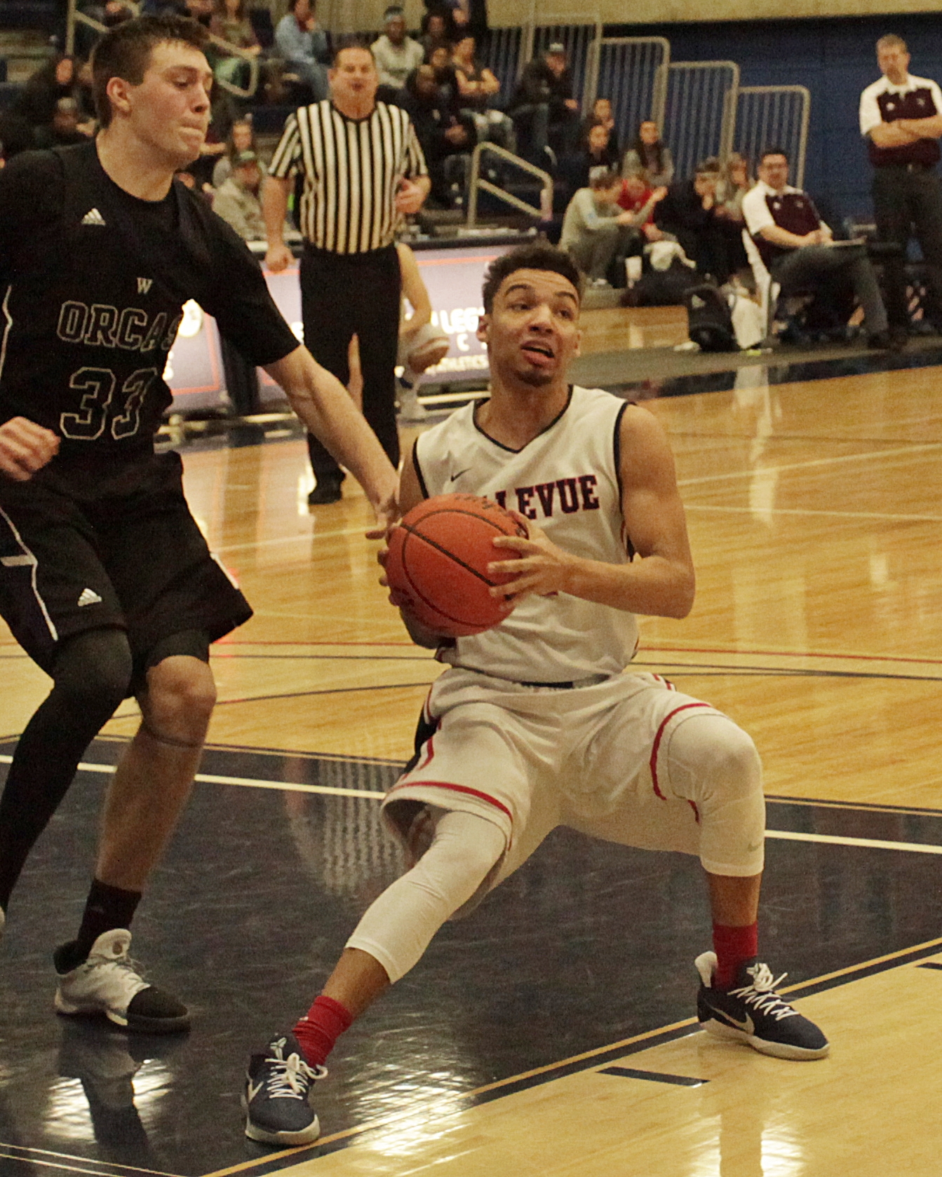 BC basketball player Trey Nelson controls the ball