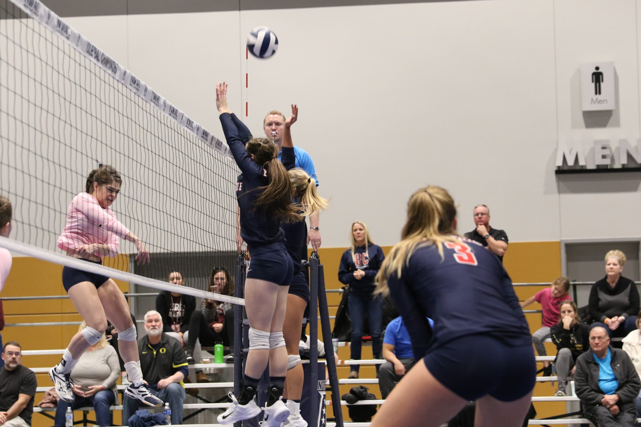 BC players attempt a block at the net
