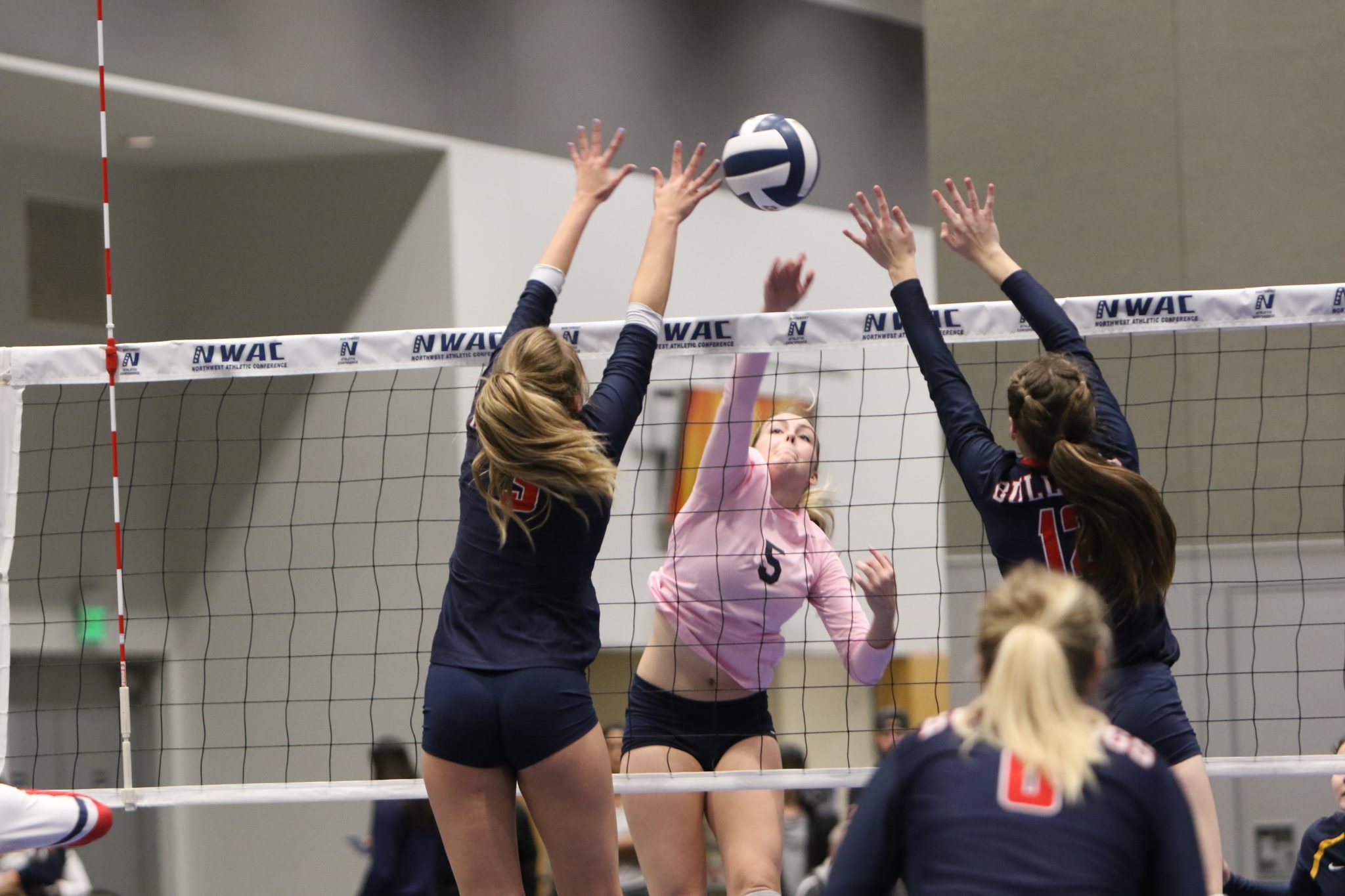 Two BC players go up for a block