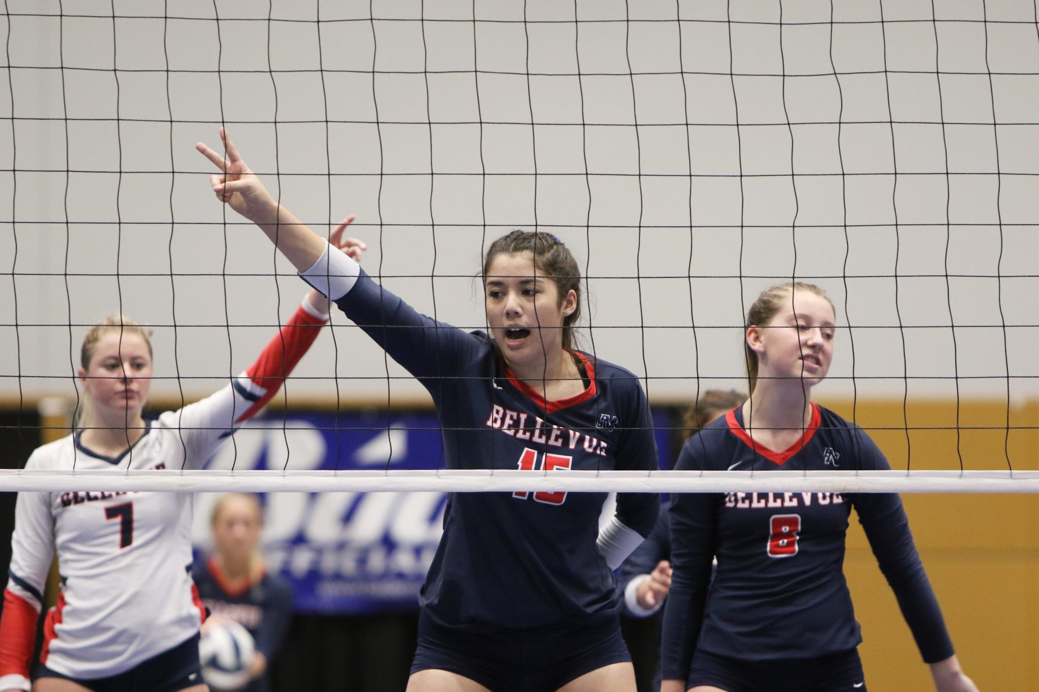 BC players at the net await the ball