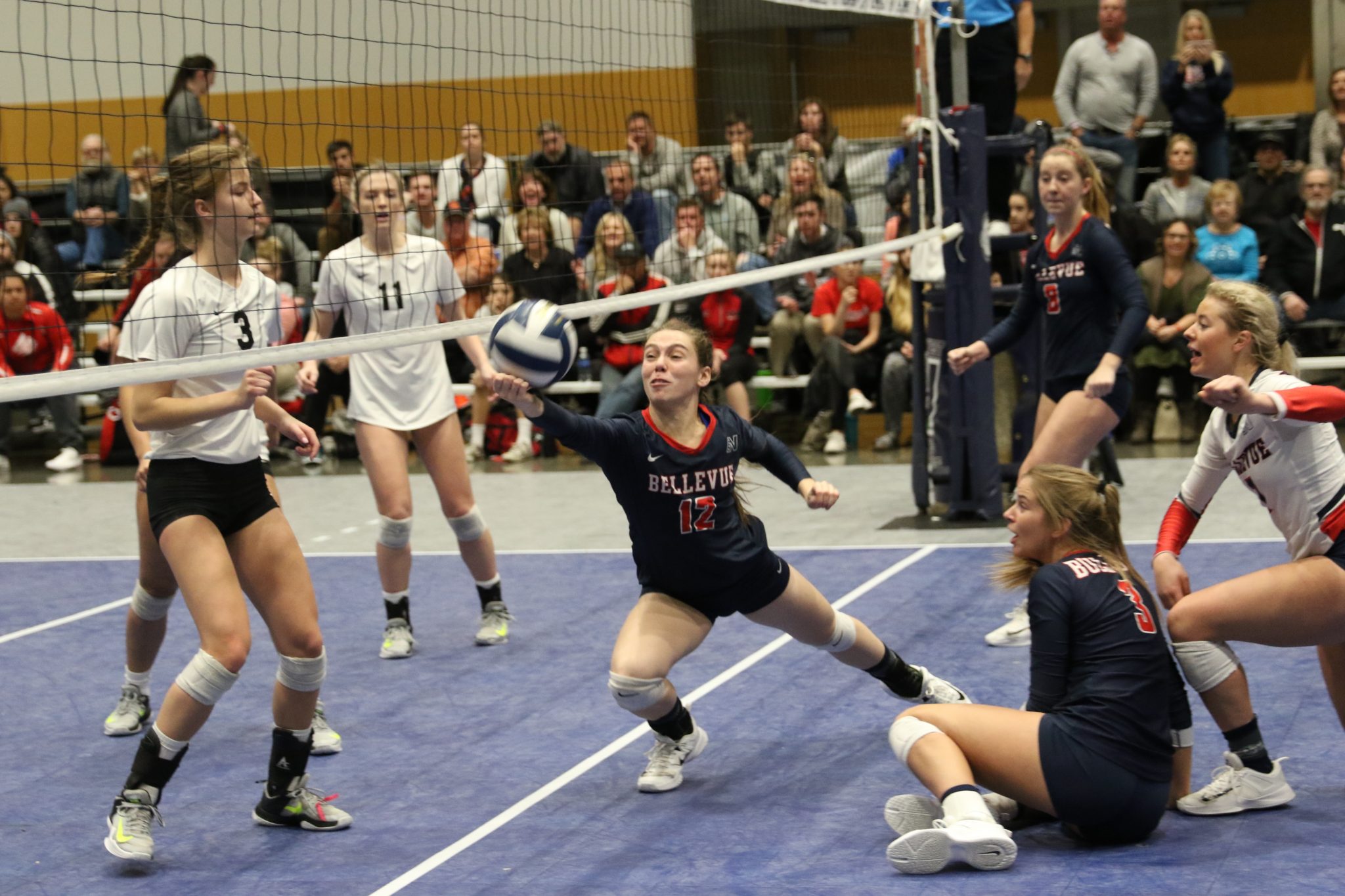 A BC player makes a one-handed dig