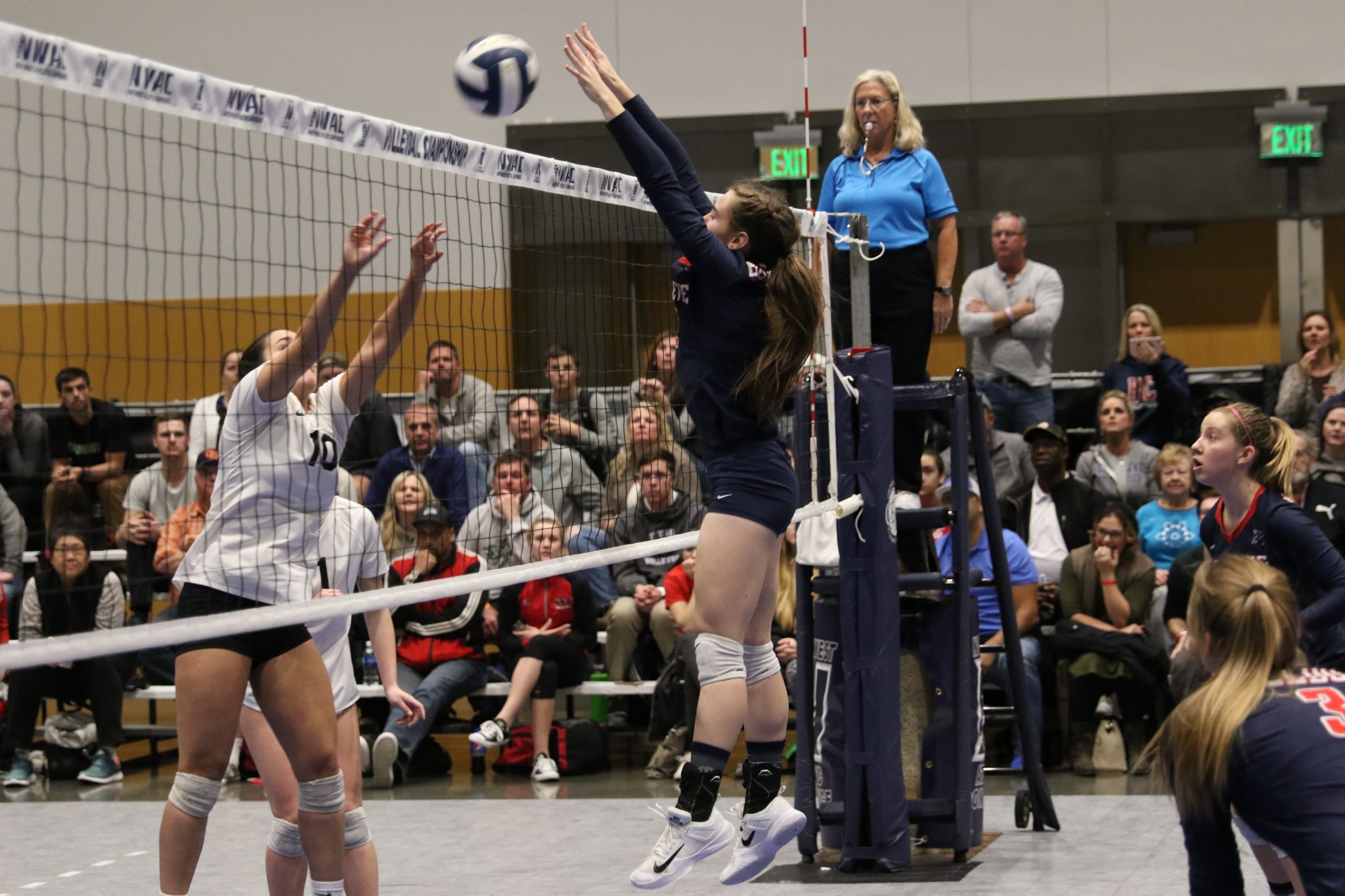 A BC player goes up for a block at the net